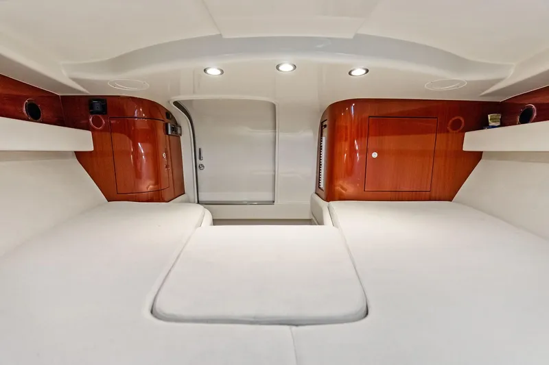 Isola Yacht Photos Pics Luxurious interior of 2013 Riva 33 Aquariva yacht with elegant wood finish.