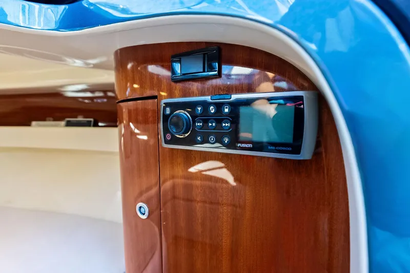 Isola Yacht Photos Pics Control panel on 2013 Riva 33 Aquariva boat, featuring sleek wood finish and modern design.