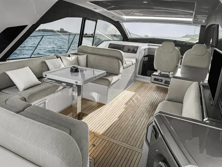  Yacht Photos Pics Luxurious interior of 2022 Azimut Atlantis 51 yacht with elegant seating and ocean view.