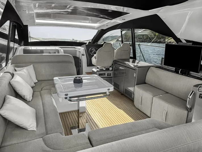  Yacht Photos Pics Luxurious interior of 2022 Azimut Atlantis 51 yacht with modern seating and sleek design.