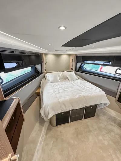  Yacht Photos Pics Luxurious bedroom interior of 2022 Azimut Atlantis 51 yacht with modern design.