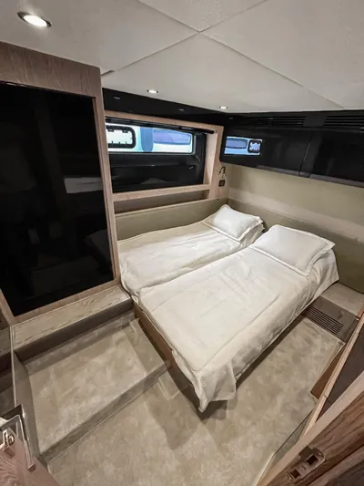  Yacht Photos Pics Luxurious cabin interior of 2022 Azimut Atlantis 51 yacht with twin beds.