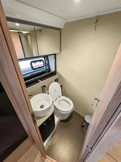  Yacht Photos Pics Bathroom interior of 2022 Azimut Atlantis 51 yacht with modern fixtures.