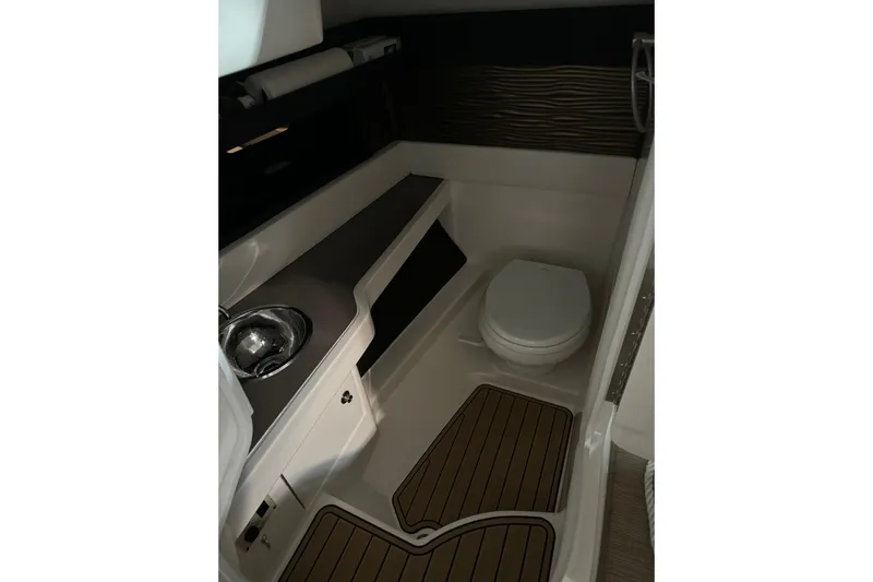  Yacht Photos Pics 2020 Sea Ray SLX 310 boat interior bathroom with sink and toilet.