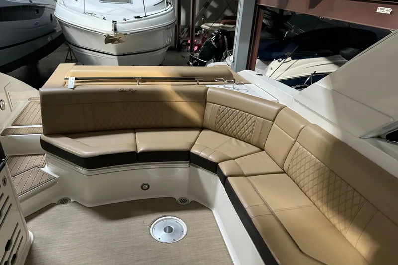  Yacht Photos Pics Luxurious seating area on a 2020 Sea Ray SLX 310 boat, featuring tan upholstery.