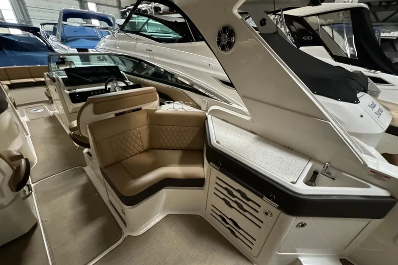  Yacht Photos Pics 2020 Sea Ray SLX 310 boat interior with luxurious seating and modern dashboard.