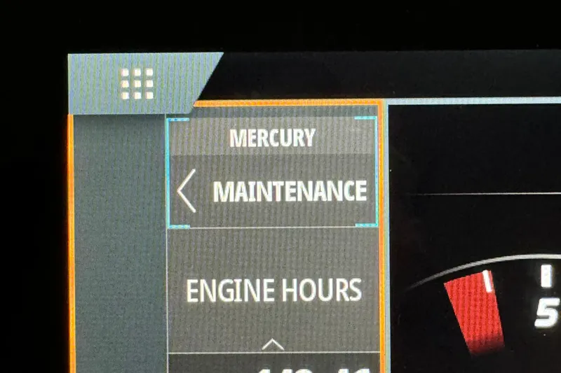  Yacht Photos Pics Dashboard display of a 2020 Sea Ray SLX 310 showing Mercury maintenance and engine hours.