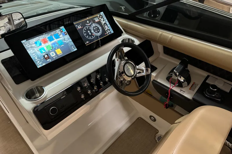  Yacht Photos Pics 2020 Sea Ray SLX 310 helm with modern touchscreen controls and luxurious steering wheel.
