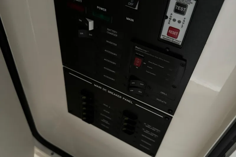  Yacht Photos Pics Control panel of a 2020 Sea Ray SLX 310 boat, featuring various switches and indicators.
