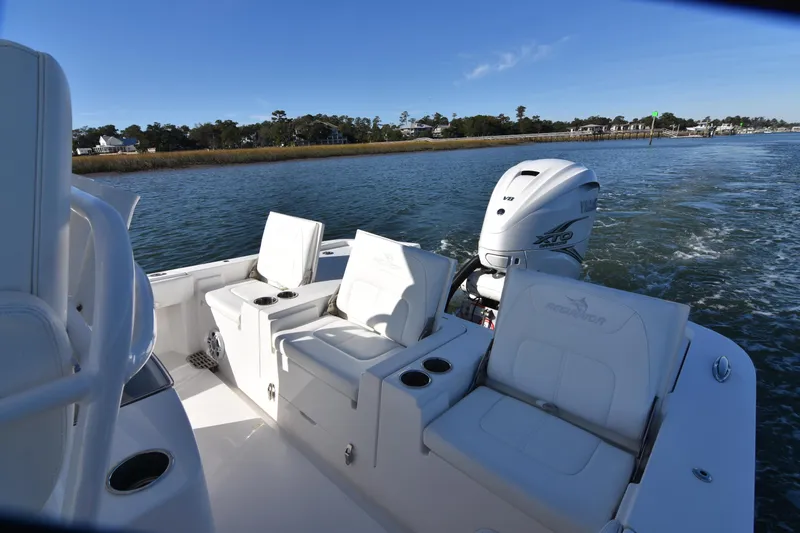  Yacht Photos Pics 2021 Regulator 26XO boat with seating and Yamaha outboard motor on water.