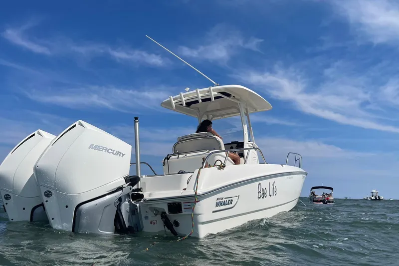 Bae Life Yacht Photos Pics 2022 Boston Whaler 270 Dauntless boat with Mercury engines on open water.