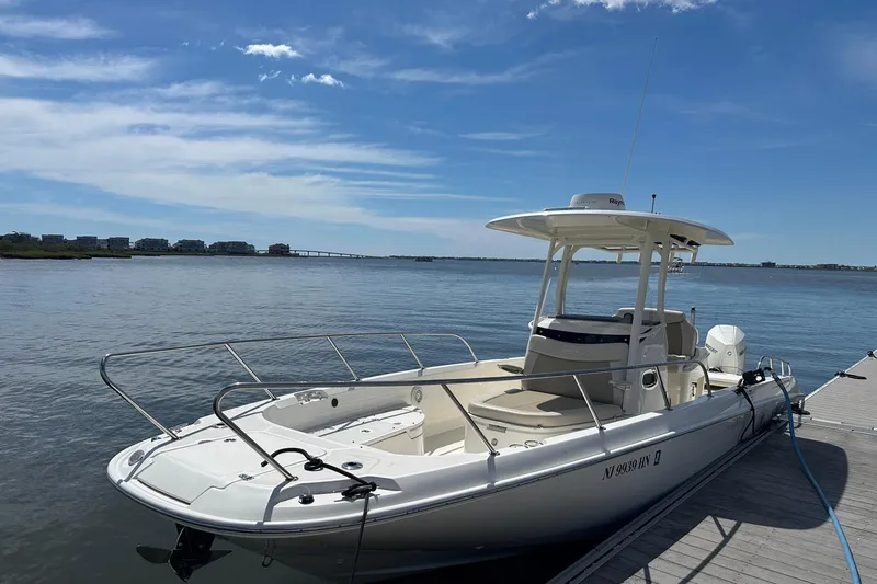 Bae Life Yacht Photos Pics 2022 Boston Whaler 270 Dauntless boat docked on a sunny day.