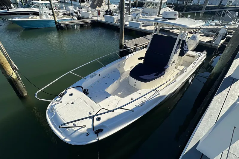 Bae Life Yacht Photos Pics 2022 Boston Whaler 270 Dauntless boat docked in marina, side view.