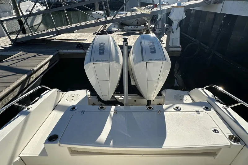Bae Life Yacht Photos Pics 2022 Boston Whaler 270 Dauntless with dual Mercury outboard engines at dock.