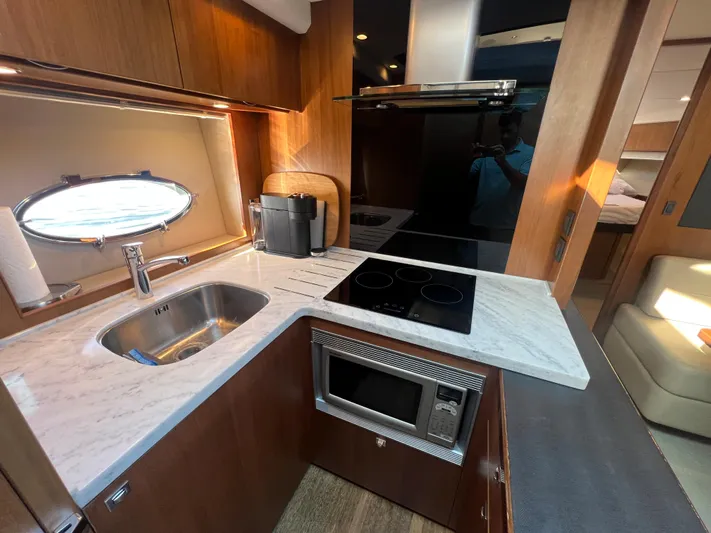  Yacht Photos Pics Modern kitchen in 2015 Viking Princess V52 yacht with stove, sink, and microwave.