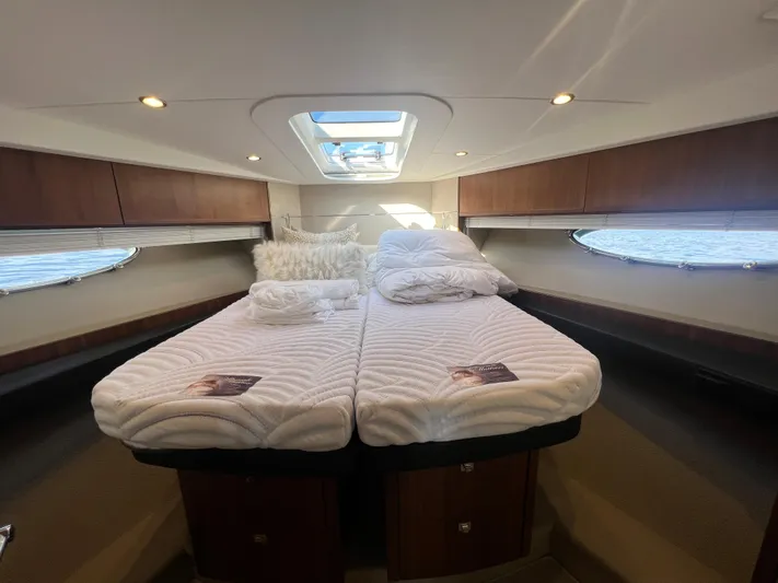  Yacht Photos Pics Luxurious cabin interior of 2015 Viking Princess V52 yacht with twin beds and skylight.