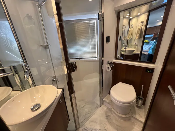  Yacht Photos Pics Luxurious bathroom in 2015 Viking Princess V52 yacht with modern fixtures and elegant design.