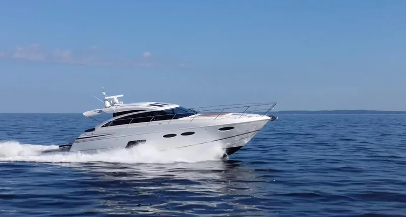  Yacht Photos Pics Luxury 2015 Viking Princess V52 yacht cruising on open sea under clear blue sky.