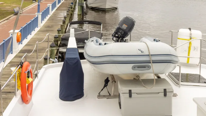  Yacht Photos Pics Deck of 2002 Kristen Yachts Pilothouse Explorer 52 with dinghy and lifebuoy.