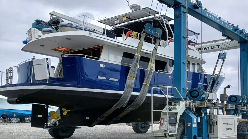  Yacht Photos Pics 2002 Kristen Yachts Pilothouse Explorer 52 being lifted by a travel lift.