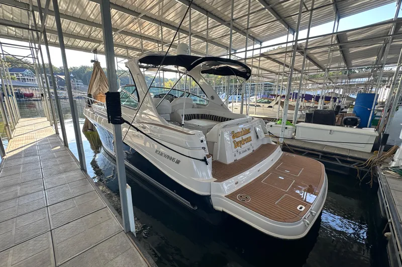  Yacht Photos Pics 2006 Four Winns 378 Vista yacht docked in a covered marina.