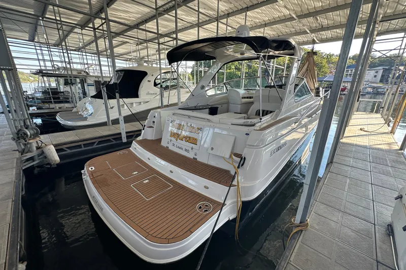  Yacht Photos Pics 2006 Four Winns 378 Vista yacht docked in a marina, featuring a spacious deck.