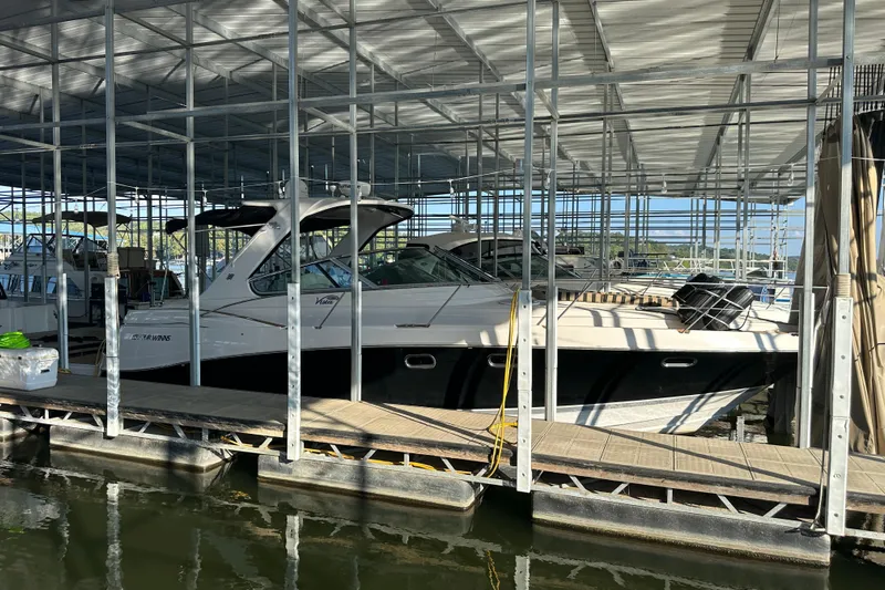  Yacht Photos Pics 2006 Four Winns 378 Vista boat docked in a covered marina.