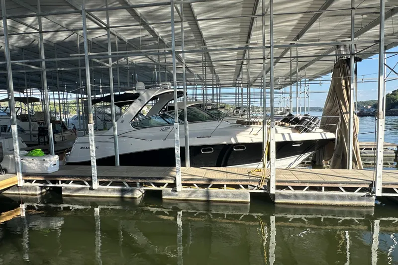  Yacht Photos Pics 2006 Four Winns 378 Vista yacht docked in a covered marina.