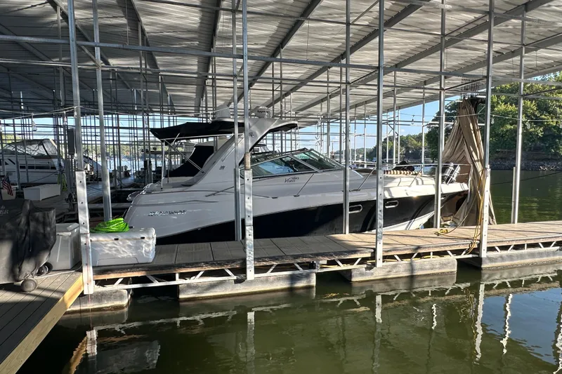  Yacht Photos Pics 2006 Four Winns 378 Vista boat docked in a covered marina.
