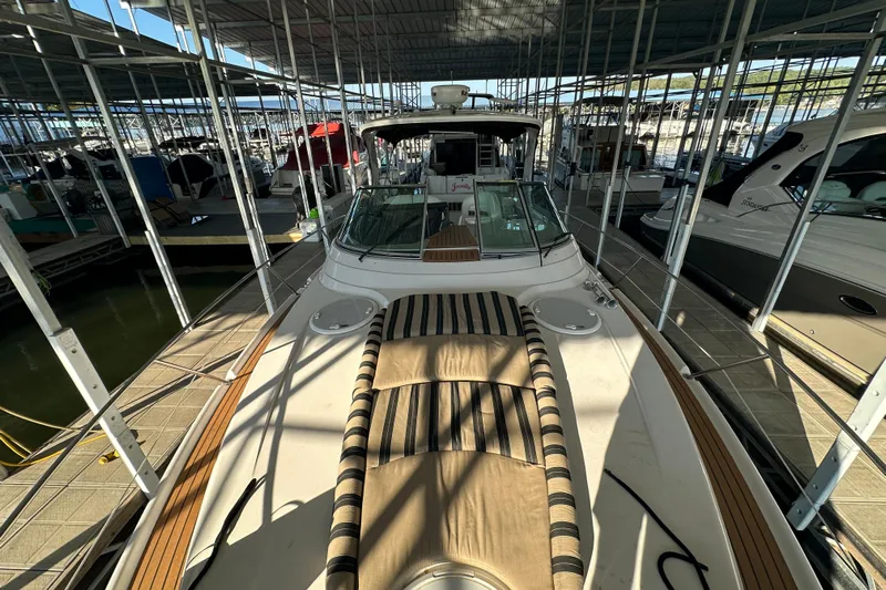  Yacht Photos Pics 2006 Four Winns 378 Vista yacht docked in a marina, featuring a spacious deck.