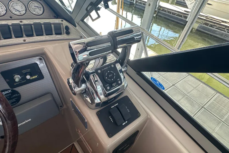  Yacht Photos Pics Control panel of a 2006 Four Winns 378 Vista boat, featuring throttle and navigation controls.