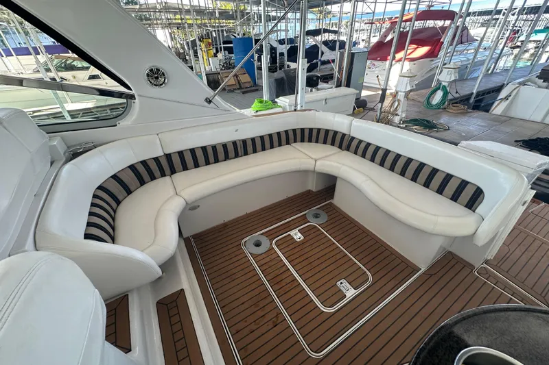  Yacht Photos Pics 2006 Four Winns 378 Vista yacht interior with white seating and wood flooring.