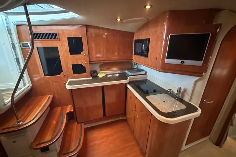  Yacht Photos Pics Luxurious 2006 Four Winns 378 Vista yacht interior with modern kitchen amenities.