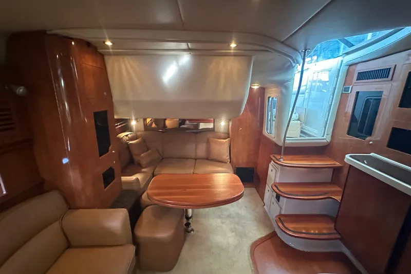  Yacht Photos Pics Luxurious 2006 Four Winns 378 Vista yacht interior with elegant seating and wooden finishes.