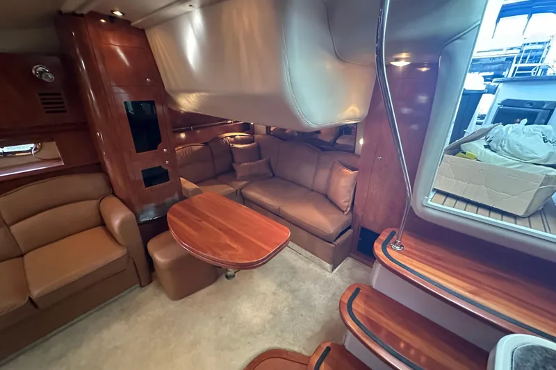  Yacht Photos Pics Luxurious interior of 2006 Four Winns 378 Vista yacht with plush seating and wooden finishes.