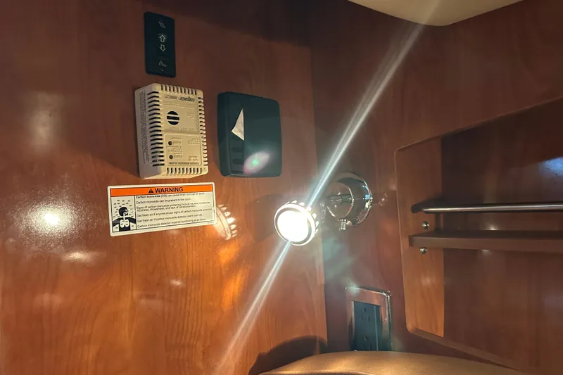  Yacht Photos Pics Interior of 2006 Four Winns 378 Vista boat with warning label and light fixture.