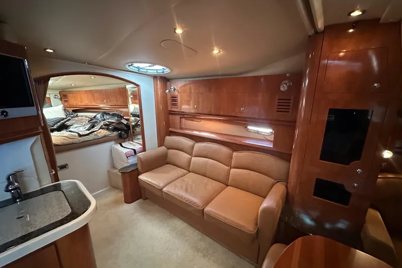  Yacht Photos Pics Luxurious interior of 2006 Four Winns 378 Vista yacht with leather seating and wood finishes.