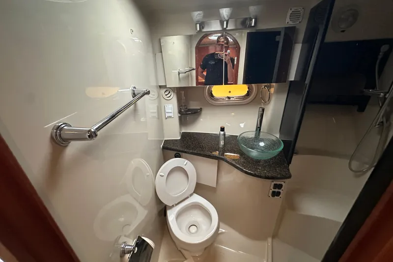  Yacht Photos Pics 2006 Four Winns 378 Vista yacht bathroom with modern fixtures and glass sink.