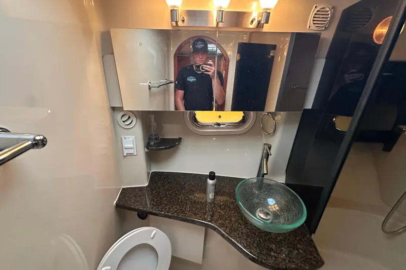  Yacht Photos Pics Bathroom interior of 2006 Four Winns 378 Vista yacht with modern fixtures and mirror.