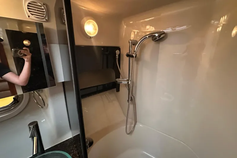  Yacht Photos Pics 2006 Four Winns 378 Vista yacht bathroom with shower and modern fixtures.