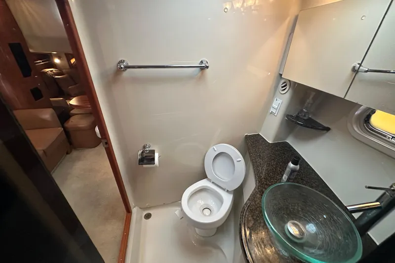  Yacht Photos Pics 2006 Four Winns 378 Vista yacht bathroom with modern fixtures and glass sink.