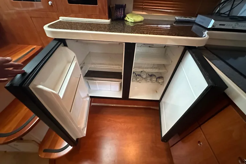  Yacht Photos Pics 2006 Four Winns 378 Vista yacht kitchen with open dual refrigerators.