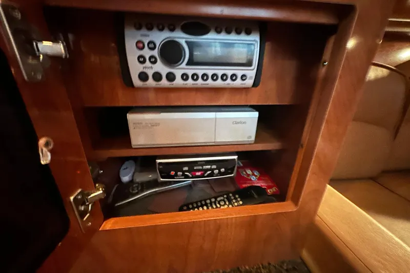  Yacht Photos Pics 2006 Four Winns 378 Vista cabin electronics, featuring a stereo system and remote controls.