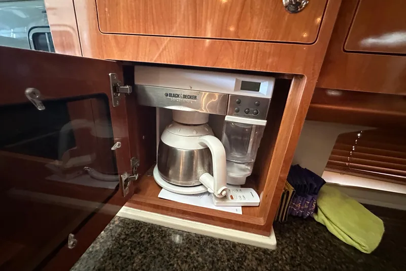  Yacht Photos Pics Built-in coffee maker in 2006 Four Winns 378 Vista yacht kitchen cabinet.