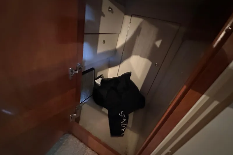  Yacht Photos Pics Open storage compartment on 2006 Four Winns 378 Vista boat with bag inside.