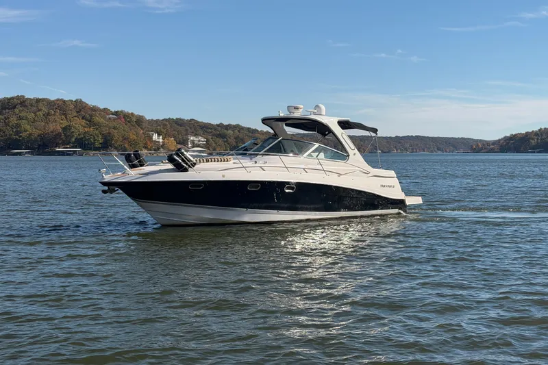  Yacht Photos Pics 2006 Four Winns 378 Vista boat cruising on a scenic lake.