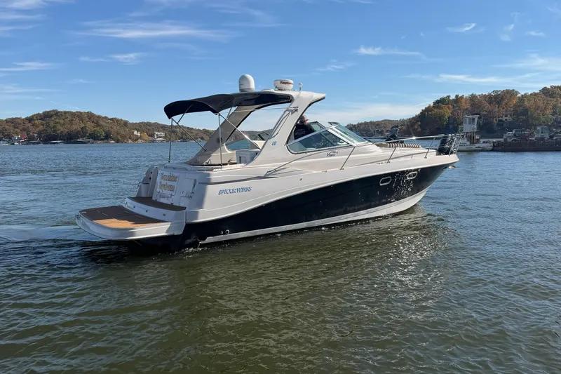  Yacht Photos Pics 2006 Four Winns 378 Vista boat cruising on a scenic lake.