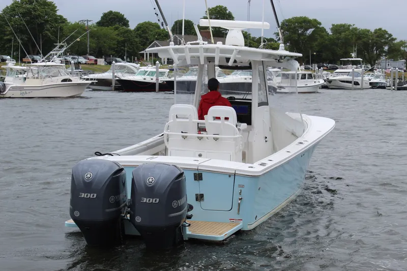 Dojo Yacht Photos Pics 2020 Regulator 28 boat with dual Yamaha 300 engines in a marina setting.