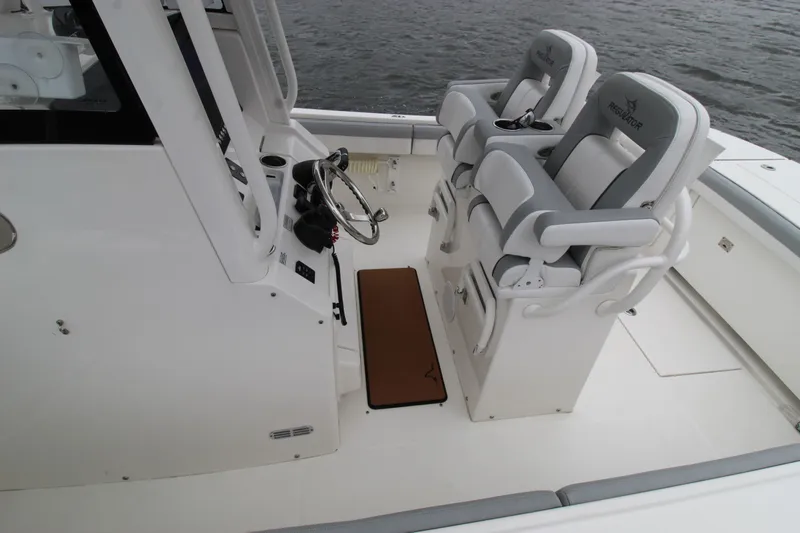 Dojo Yacht Photos Pics 2020 Regulator 28 boat cockpit with dual helm seats and steering wheel.