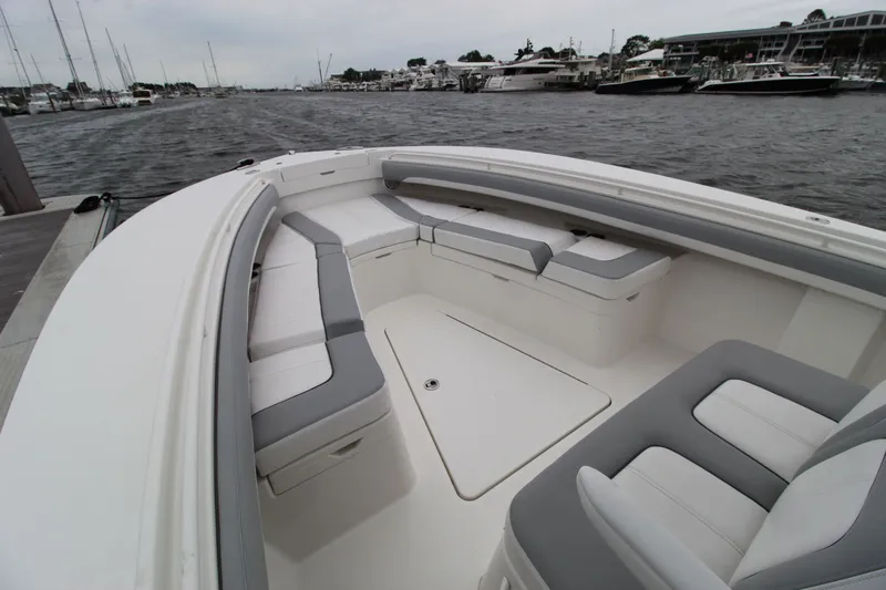 Dojo Yacht Photos Pics 2020 Regulator 28 boat with spacious seating, docked in a marina.